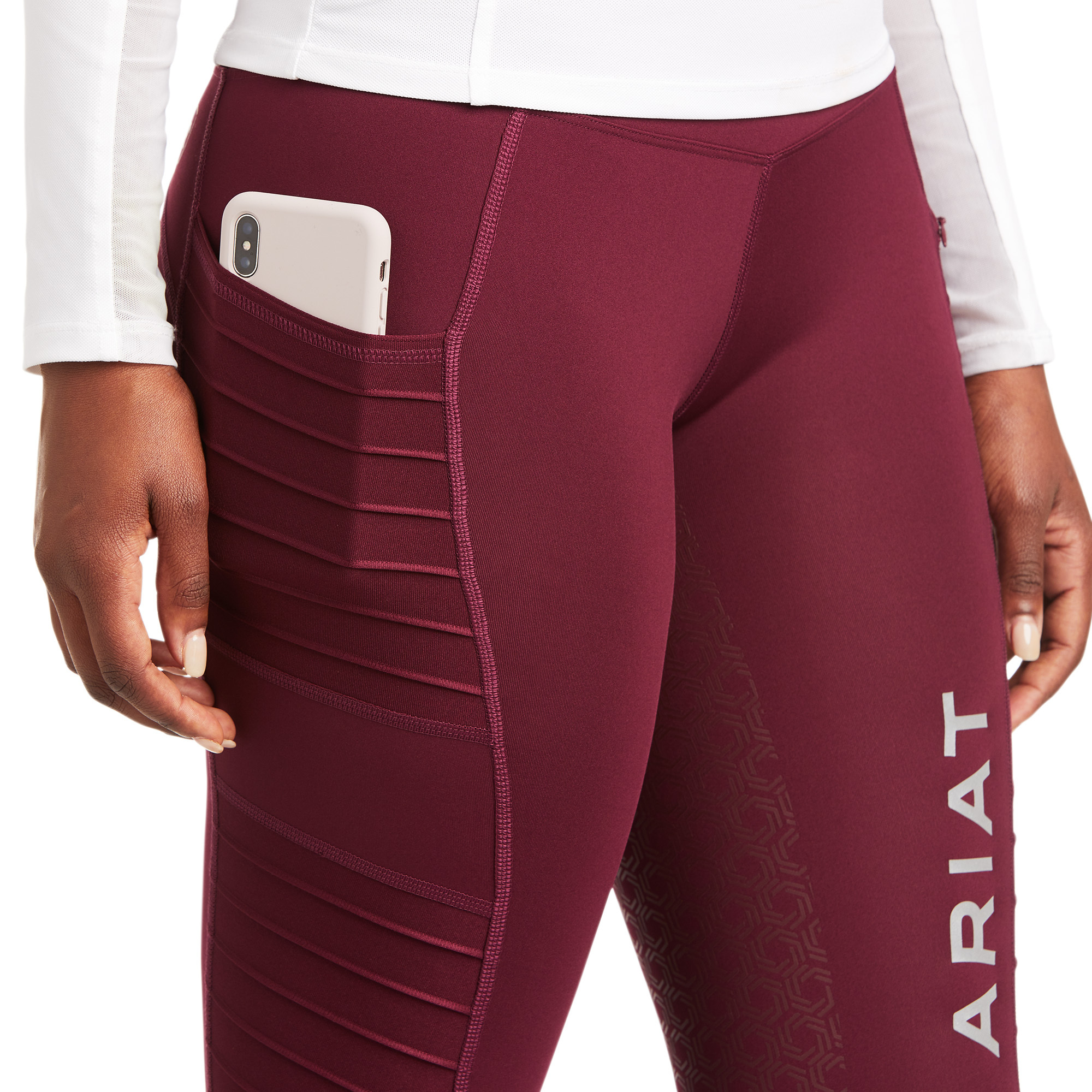 Close-up of the Ariat EOS riding tights side phone pocket designed for carrying essentials while riding and working around the yard
