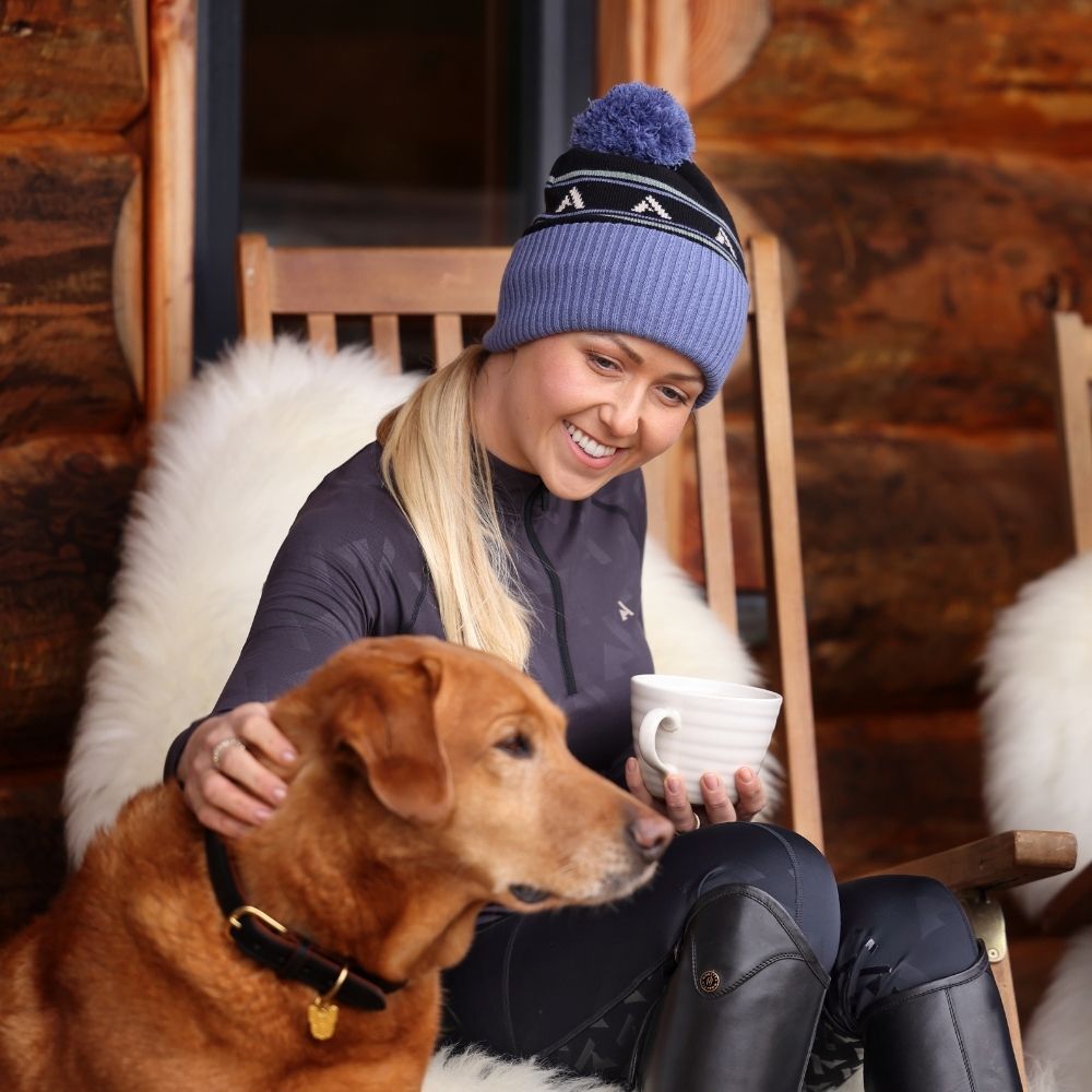 Female horse rider wearing equestrian thermal base layer