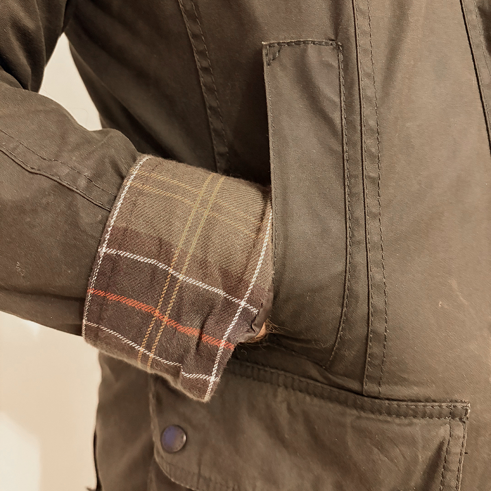 Close up of Barbour wax jacket cuff and pocket