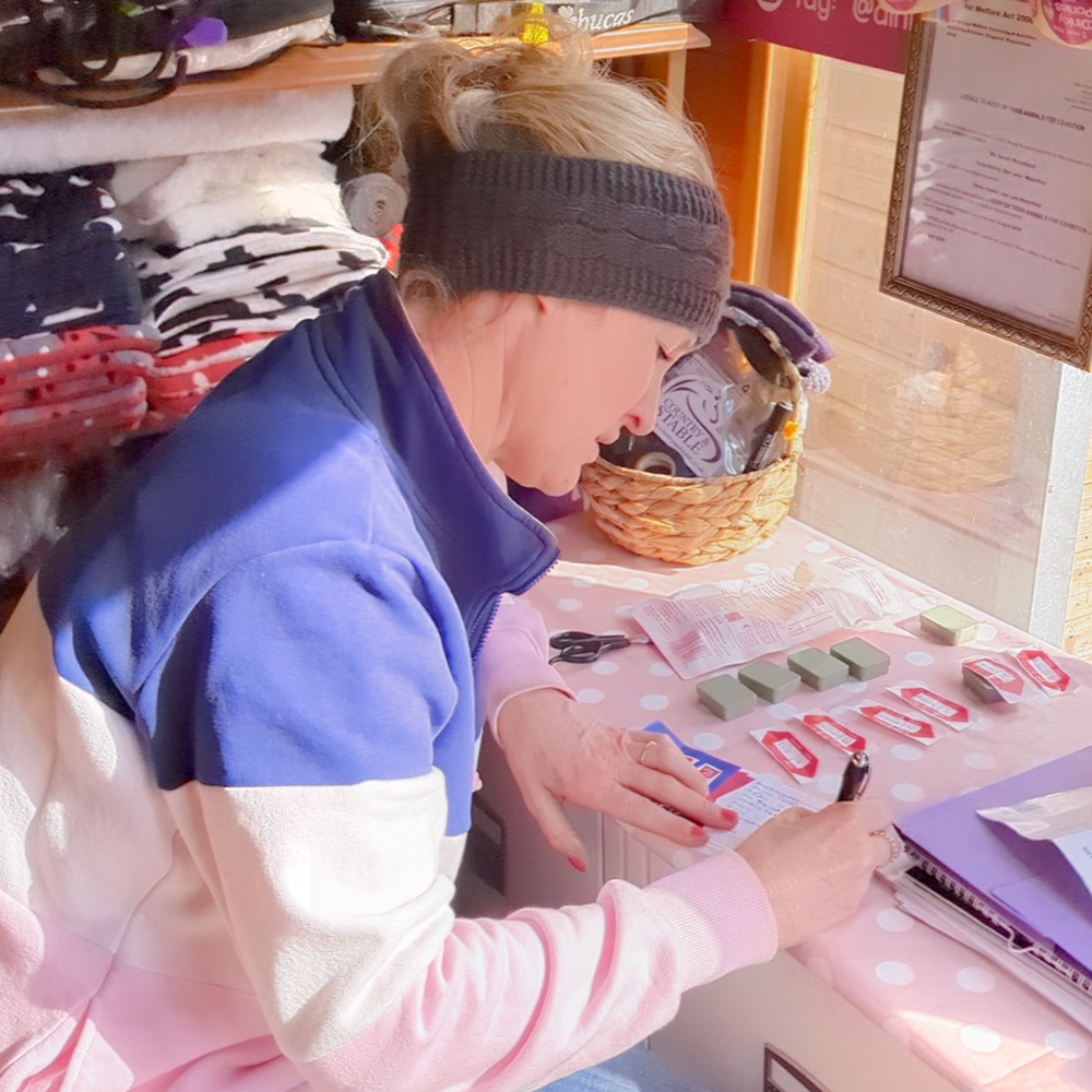 Completing worm egg count for horses form and putting sample in envelope