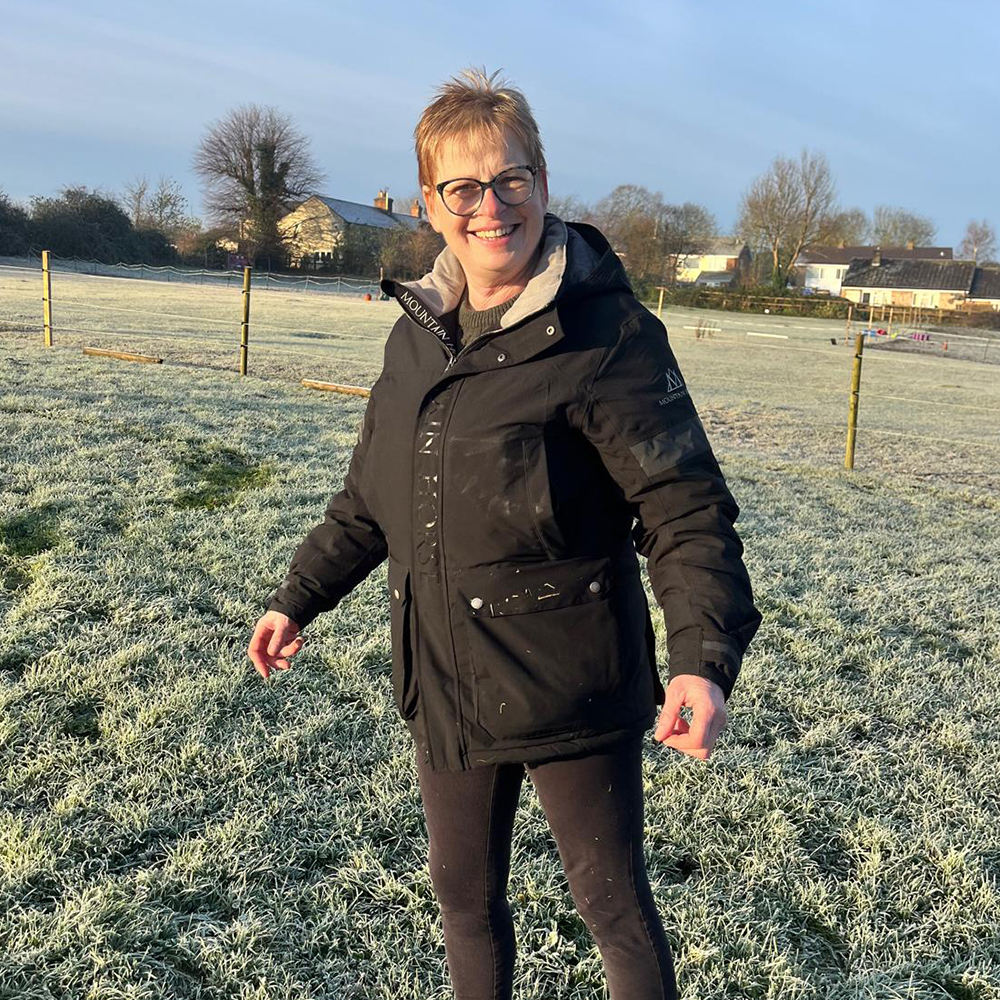 Woman wearing the mountain Horse Galaxy Parker in field on cold winter day