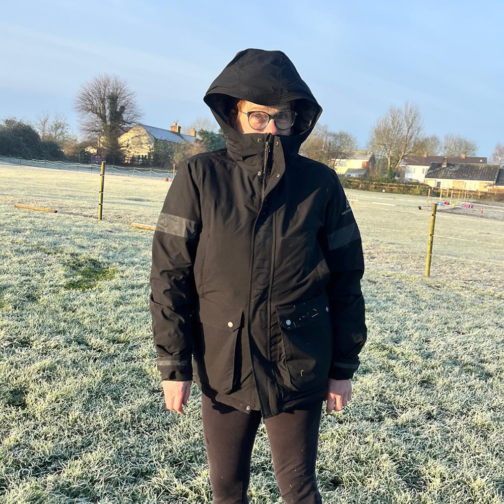 Woman wearing Galaxy Parka with large hood up by Mountain Horse 