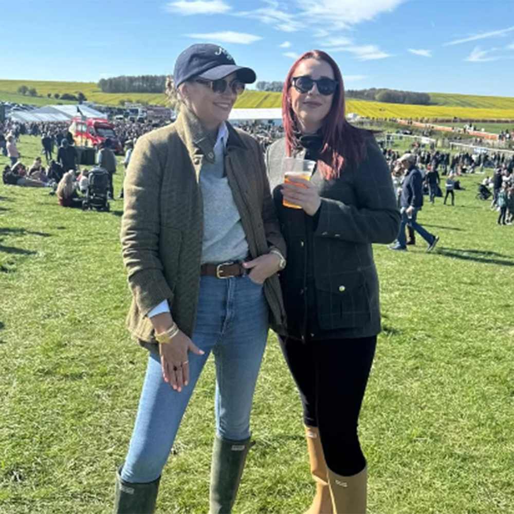 Two women wearing ladies British country clothing at Point to Point