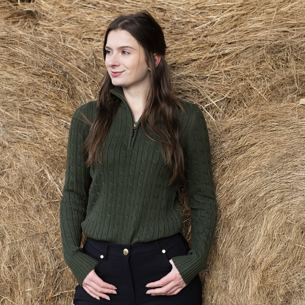 Woman wearing green Rydale ladies country quarter zip jumper