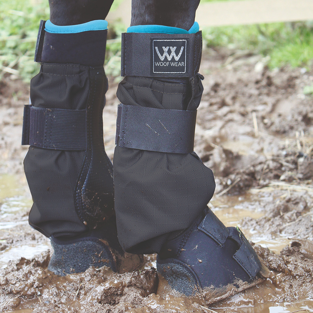Woof Wear Turnout Mud Fever Boots in muddy field